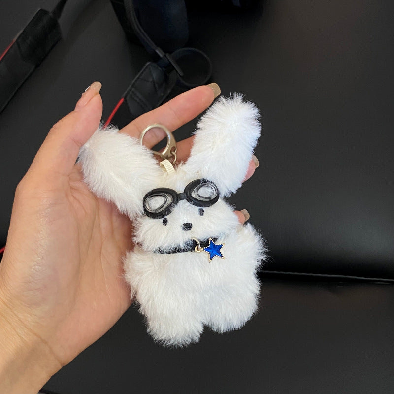 Glasses puppy plush toy pendant on hand