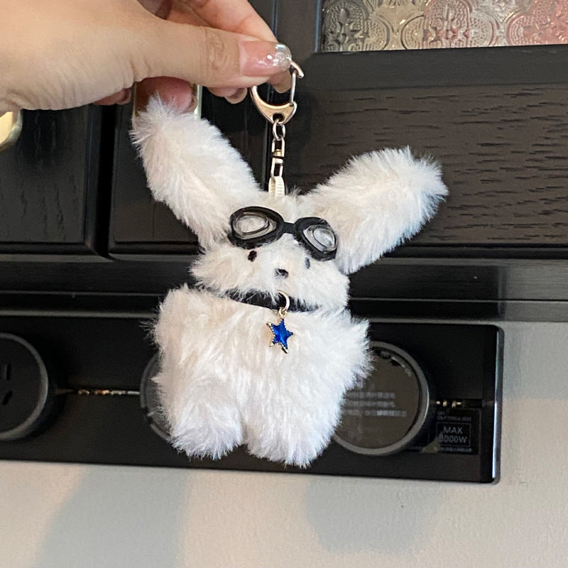 Glasses puppy plush toy pendant in hand