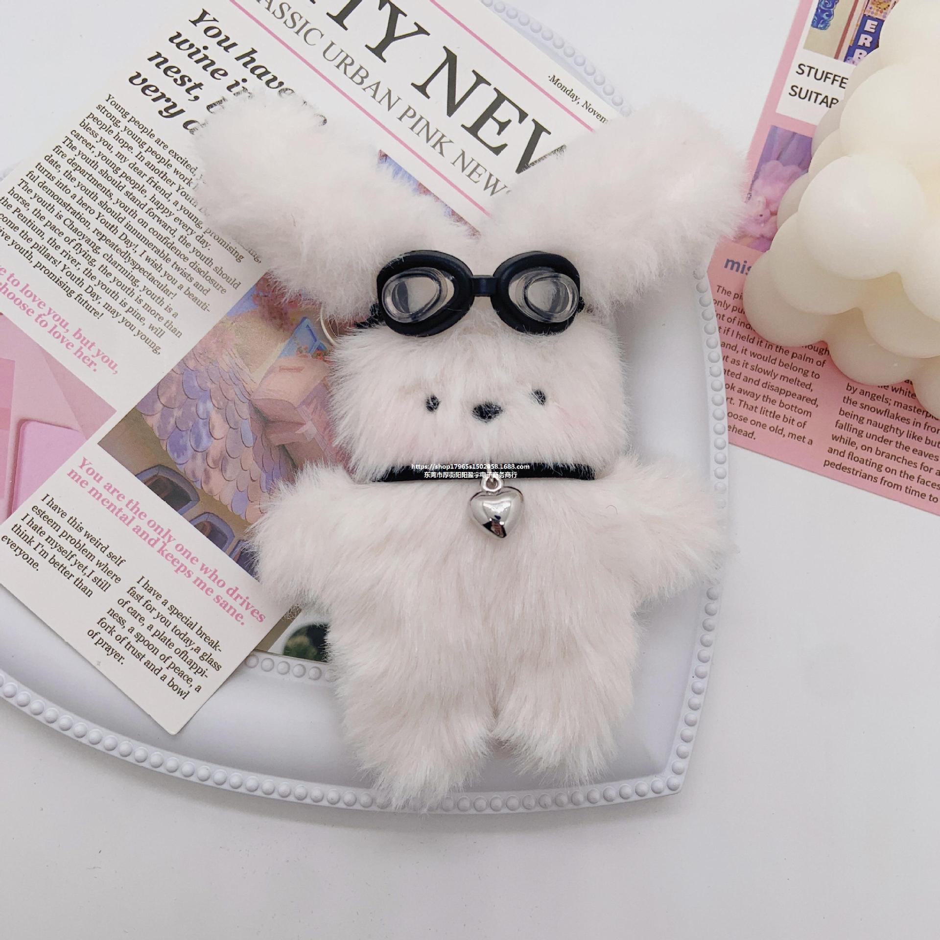 Spectacled puppy plush toy hanging on the table