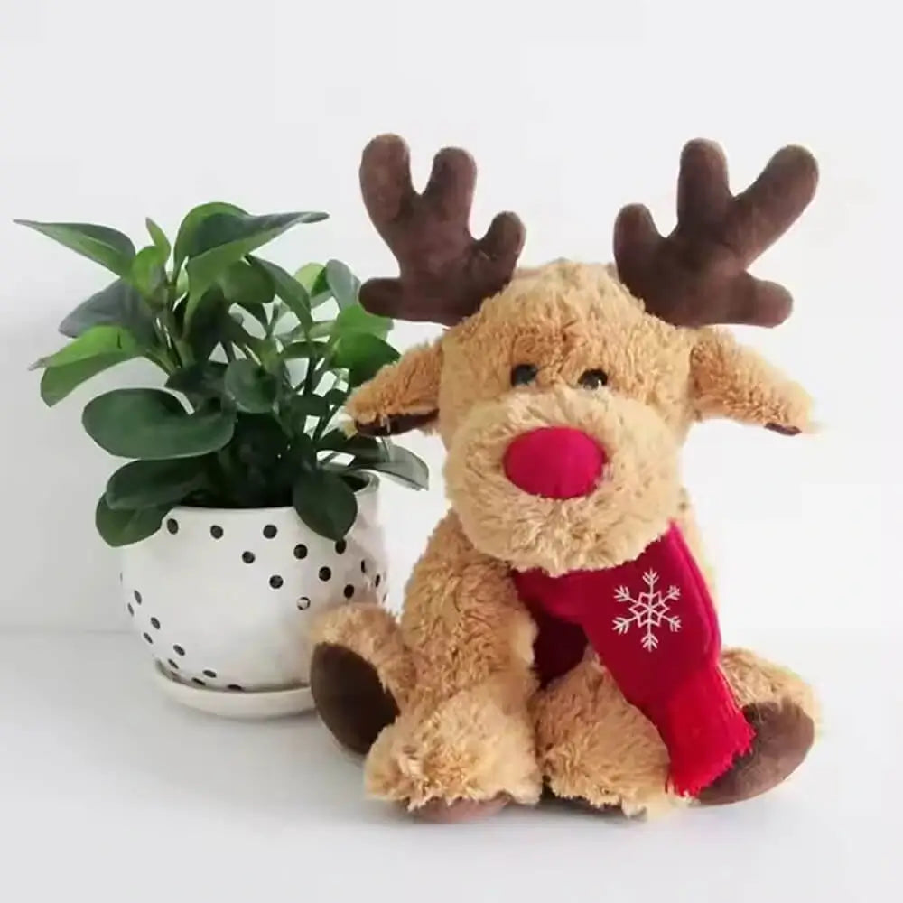 Christmas elk plush toy placed next to green plants