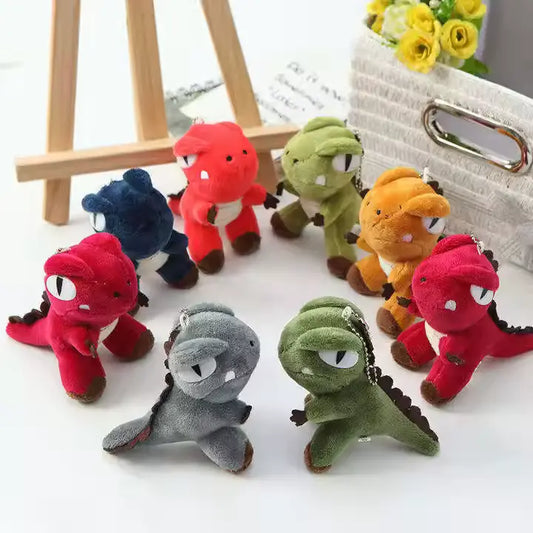 Eight dinosaur toy keychains forming a circle