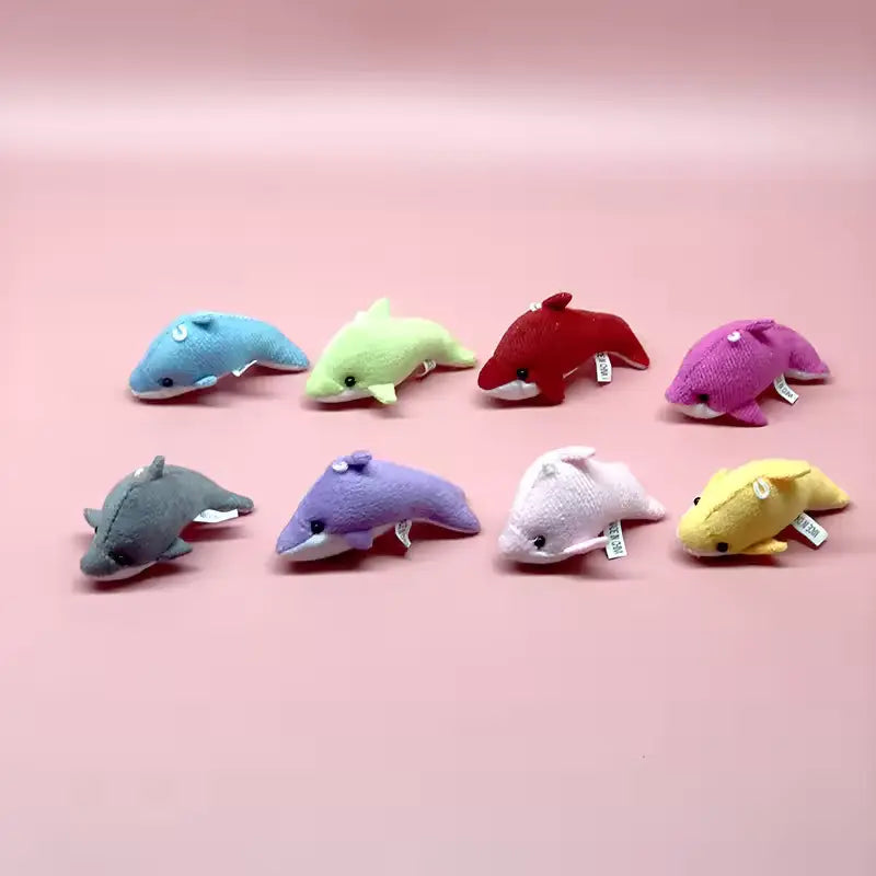 Eight mini whale stuffed animals