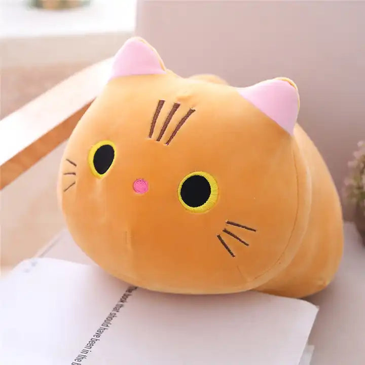 A cute plush doll of a orange kitten, showcasing its adorable features and soft, cuddly fur – a perfect feline friend for cozy moments
