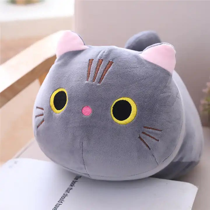 A cute plush doll of a grey kitten, showcasing its adorable features and soft, cuddly fur – a perfect feline friend for cozy moments