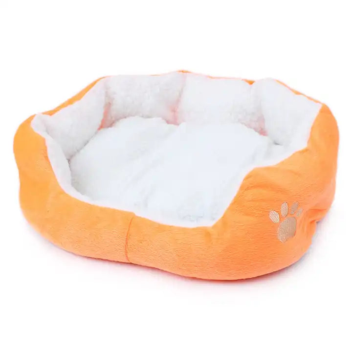 An adorable orange dog basket with a cute canine design – a cozy and stylish addition for your furry friend's comfort