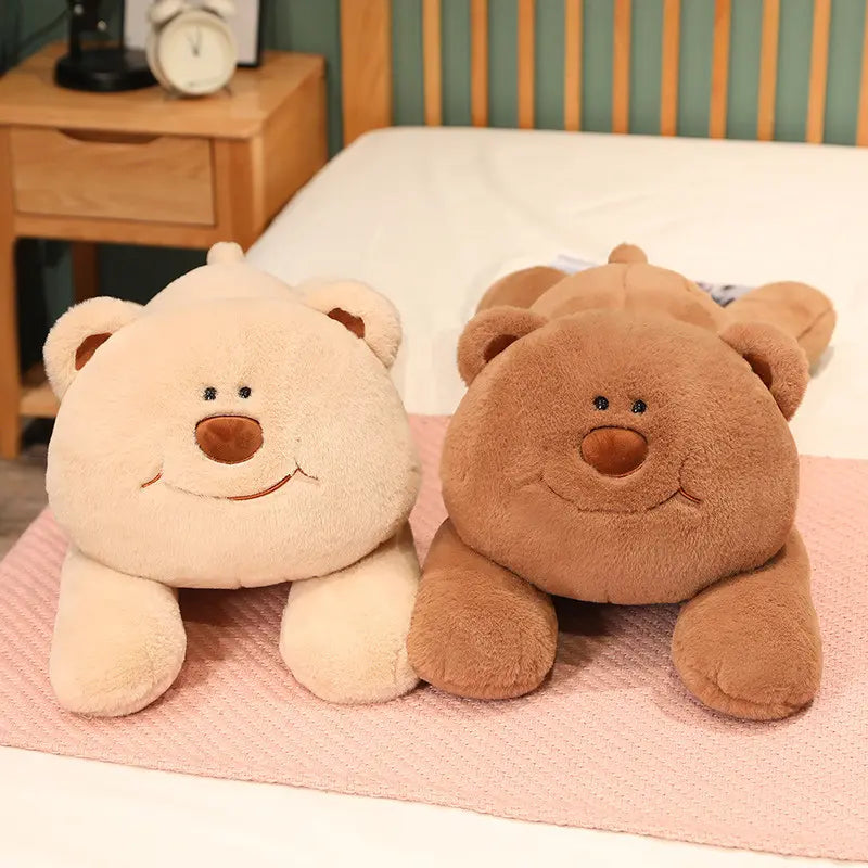 Two bear weighted stuffed animals lying on the bed