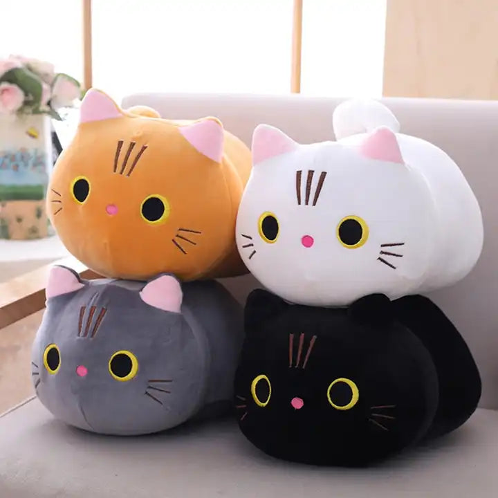 A cute plush doll of kittens, showcasing its adorable features and soft, cuddly fur – a perfect feline friend for cozy moments