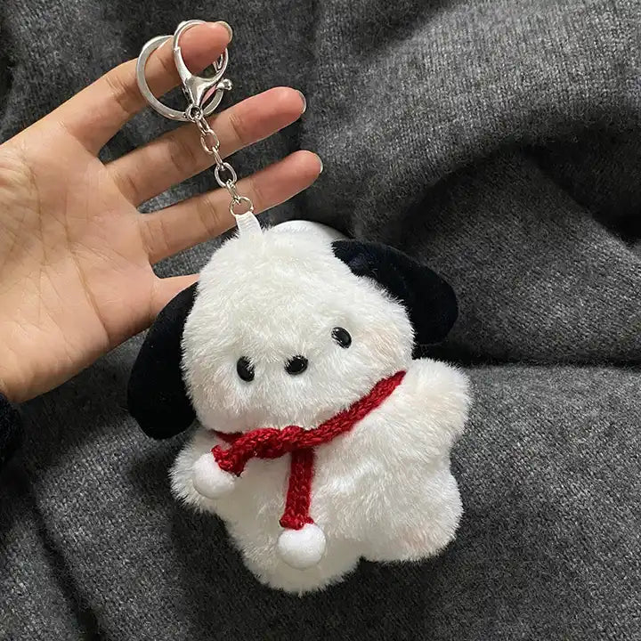 Big-eared puppy plush toy pendant in hand
