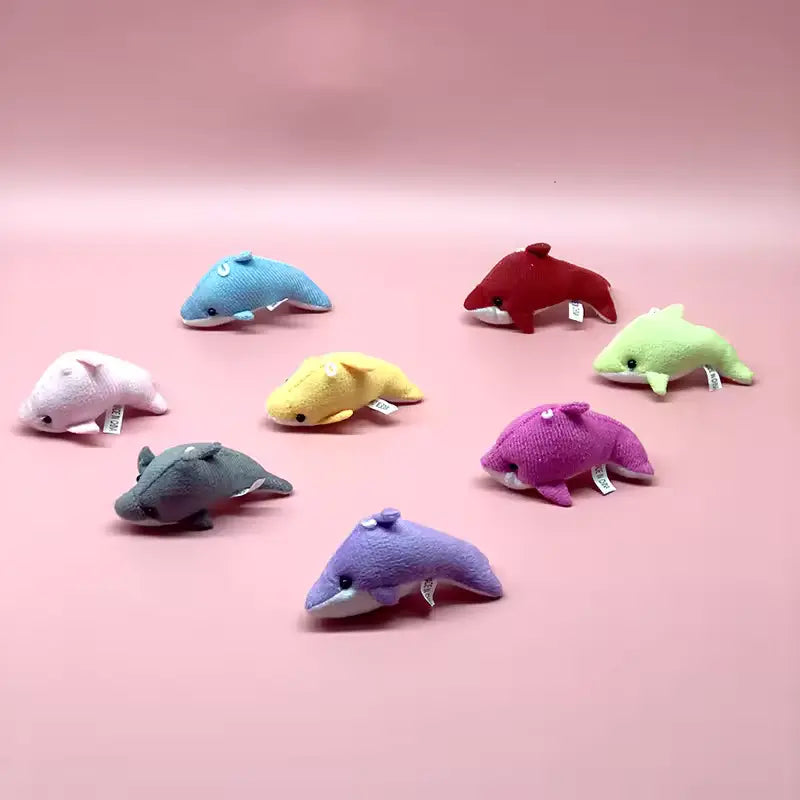 Mini whale stuffed animals in various colors
