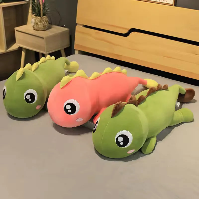 Three dinosaur pillow plush toys