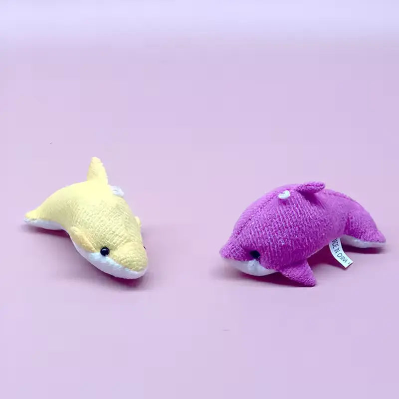 Two mini whale stuffed animals