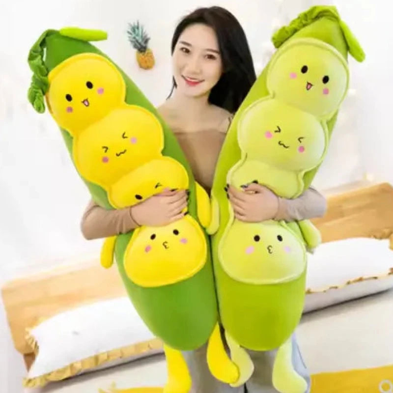 Woman and two pea stuffed animals