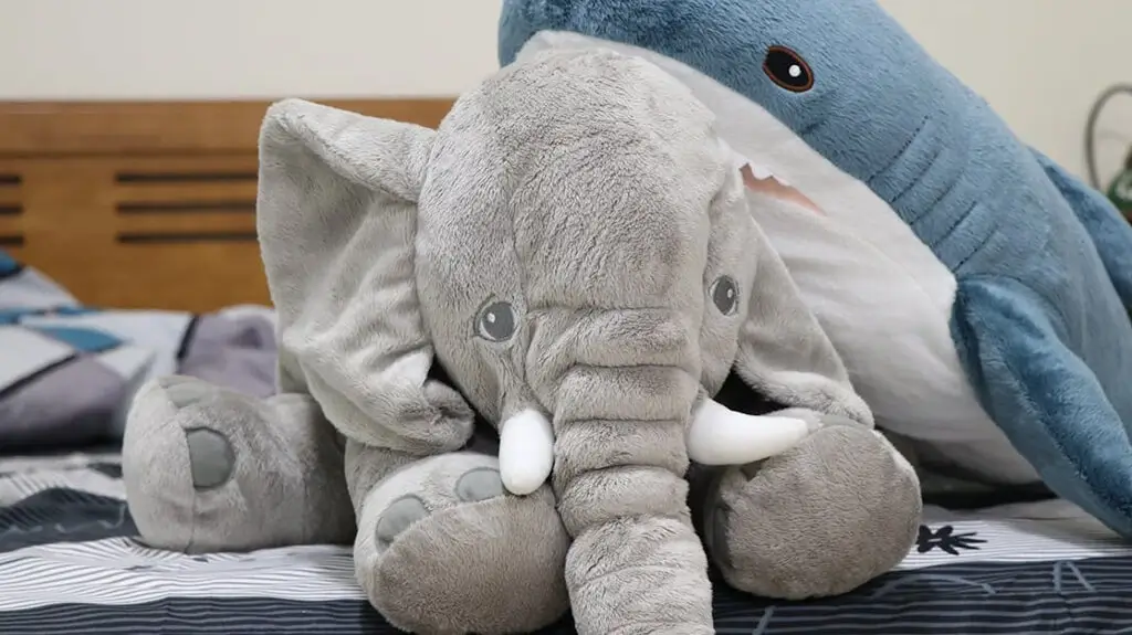 Baby elephant and baby shark plush toys