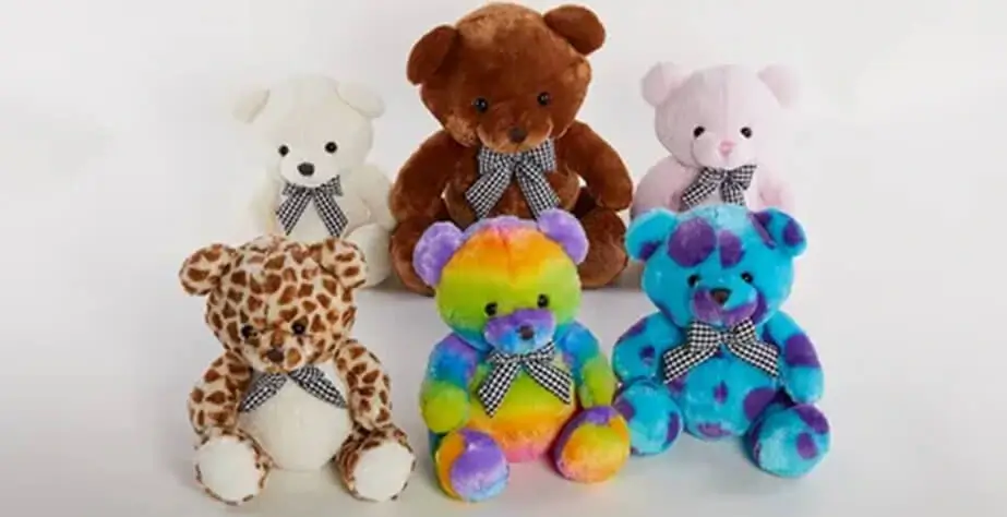 Four teddy bears of different colors
