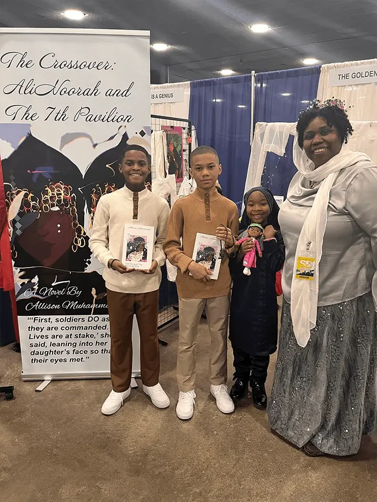 Book fans pose for photos with plush toys made from characters from the book.