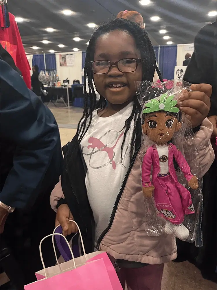 The young readers happily held the plush toys made from the characters in the book.