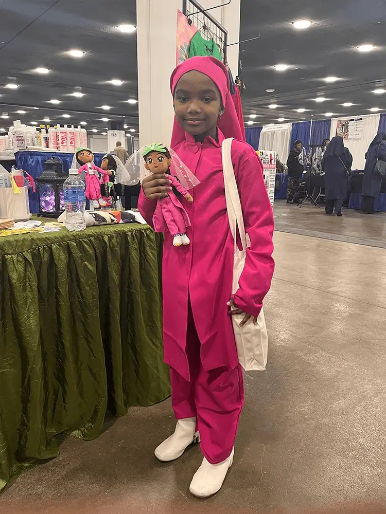 Young readers pose for photos with plush toys of characters from the book.2