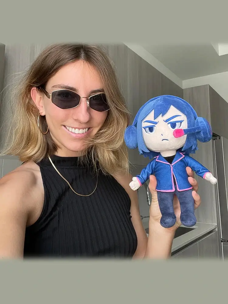 Catie poses with her plush toys.