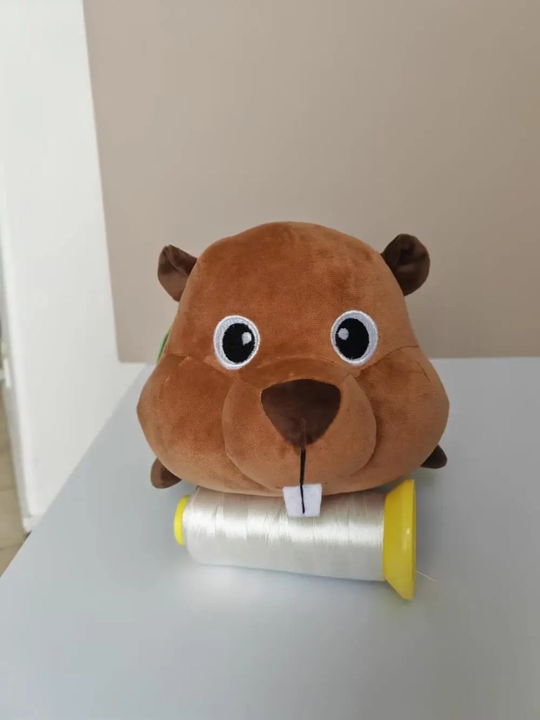 Front view of beaver plush toy