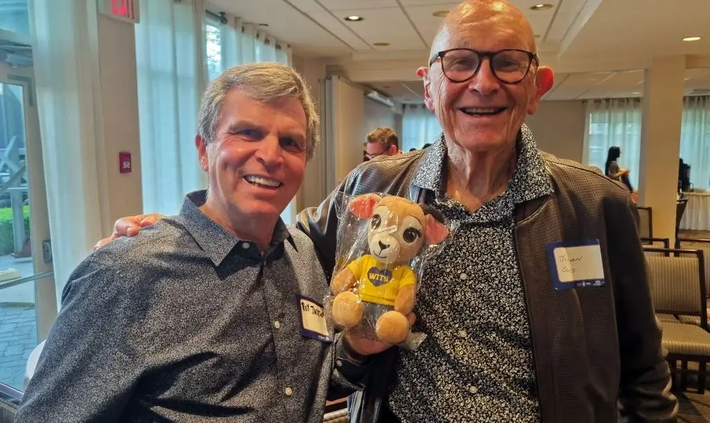 Take a photo with school leaders holding a plush toy customized with the school mascot